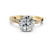 Side Accent Engagement Ring Setting for Round Cut Center with Accent Shoulders and Prong Head in Yellow Gold
