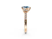 Paired Accent Engagement Ring Setting for Fancy Blue Pear-Shaped Center with Pave Band and Prong Head in Rose Gold