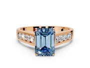 Solitaire Engagement Ring Setting for Fancy Blue Emerald Cut Center with Cathedral Channel Band and Prong Head in Rose Gold