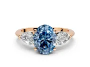 3 Stone Engagement Ring Setting for Fancy Blue Oval Center with Large Pear-Shaped Accents and Prong Head in Rose Gold