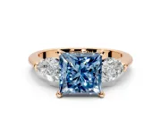 3 Stone Engagement Ring Setting for Fancy Blue Princess Cut Center with Large Pear-Shaped Accents and Prong Head in Rose Gold