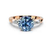 3 Stone Engagement Ring Setting for Fancy Blue Round Cut Center with Baguette Accents and Prong Head in Rose Gold