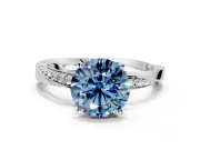 Side Accent Engagement Ring Setting for Fancy Blue Round Cut Center with Accent Shoulders and Prong Head in Platinum
