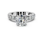 Solitaire Engagement Ring Setting for Round Cut Center with Channel-Set Accents and Prong Head in White Gold