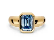 Solitaire Engagement Ring Setting for Fancy Blue Emerald Cut Center with Wide Band and Bezel Head in Yellow Gold
