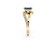 Solitaire Engagement Ring Setting for Fancy Blue Emerald Cut Center with Pave Bypass Swirl Band and Prong Head in Yellow Gold