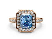 Bezel-Framed Halo Engagement Ring Setting for Fancy Blue Radiant Cut Center with Pave Band and Prong Head in Rose Gold