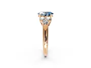 Cluster Engagement Ring Setting for Fancy Blue Oval Center with Round Cut Accent Frame and Prong Head in Rose Gold