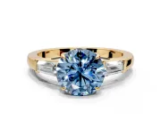3 Stone Engagement Ring Setting for Fancy Blue Round Cut Center with Baguette Accents and Prong Head in Yellow Gold