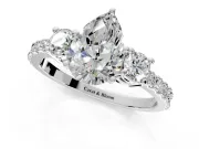 3 Stone Engagement Ring Setting for Pear-Shaped Center with Round Cut Side Accents and Prong Head in Platinum