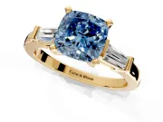 3 Stone Engagement Ring Setting for Fancy Blue Cushion Cut Center with Channel Baguette Accents and Prong Head in Yellow Gold