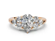 Cluster Engagement Ring Setting for Pear-Shaped Center with Round Cut Accent Frame and Prong Head in Rose Gold