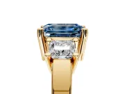 3 Stone Engagement Ring Setting for Fancy Blue Emerald Cut Center with Matching Side Accents and Prong Head in Yellow Gold