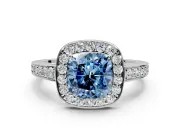 Bezel-Framed Halo Engagement Ring Setting for Fancy Blue Cushion Cut Center with Pave Band and Prong Head in Platinum