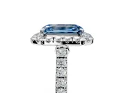 Halo Engagement Ring Setting for Fancy Blue Emerald Cut Center with Narrowing Pave Band and Prong Head in Platinum