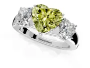 3 Stone Engagement Ring Setting for Fancy Yellow Heart-Shaped Center with Raised Basket Heads and Prong Head in Platinum