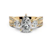3 Stone Engagement Ring Setting for Pear-Shaped Center with Pave Twist Band and Prong Head in Yellow Gold