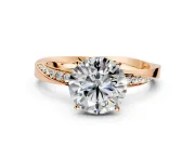 Side Accent Engagement Ring Setting for Round Cut Center with Accent Shoulders and Prong Head in Rose Gold
