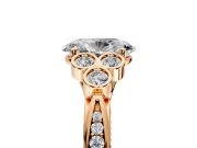 Cluster Engagement Ring Setting for Oval Center with Bezel Accent Clusters and Prong Head in Rose Gold