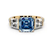 Channel-Set Engagement Ring Setting for Fancy Blue Asscher Cut Center with Baguette Band and Prong Head in Yellow Gold