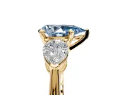 3 Stone Engagement Ring Setting for Fancy Blue Pear-Shaped Center with Large Pear-Shaped Accents and Prong Head in Yellow Gold
