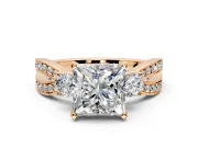 3 Stone Engagement Ring Setting for Princess Cut Center with Pave Twist Band and Prong Head in Rose Gold