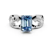 Solitaire Engagement Ring Setting for Fancy Blue Emerald Cut Center with Criss-Cross Accent Band and Prong Head in Platinum