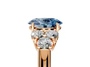 Cluster Engagement Ring Setting for Fancy Blue Oval Center with Round Cut Accent Frame and Prong Head in Rose Gold