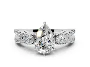 3 Stone Engagement Ring Setting for Pear-Shaped Center with Pave Split Shank and Prong Head in Platinum