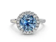 Halo Engagement Ring Setting for Fancy Blue Round Cut Center with Narrowing Pave Band and Prong Head in White Gold