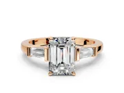 3 Stone Engagement Ring Setting for Emerald Cut Center with Channel Baguette Accents and Prong Head in Rose Gold