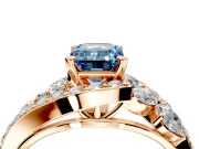 Halo Engagement Ring Setting for Fancy Blue Emerald Cut Center with Marquise and Pave Bypass Band and Prong Head in Rose Gold