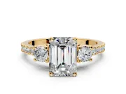 3 Stone Engagement Ring Setting for Emerald Cut Center with Round Cut Side Accents and Prong Head in Yellow Gold