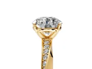 Side Accent Engagement Ring Setting for Round Cut Center with Accent Shoulders and Prong Head in Yellow Gold