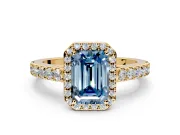Halo Engagement Ring Setting for Fancy Blue Emerald Cut Center with Full Pave Band and Prong Head in Yellow Gold