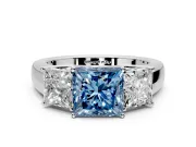 3 Stone Engagement Ring Setting for Fancy Blue Princess Cut Center with Raised Basket Heads and Prong Head in Sterling Silver