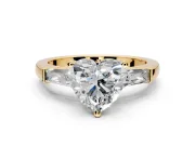 3 Stone Engagement Ring Setting for Heart-Shaped Center with Tapered Baguettes, Plain Band and Prong Head in Yellow Gold