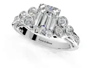 Cluster Engagement Ring Setting for Emerald Cut Center with Bezel Accent Clusters and Prong Head in Platinum
