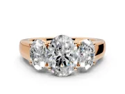 3 Stone Engagement Ring Setting for Oval Center with Raised Basket Heads and Prong Head in Rose Gold