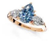 3 Stone Engagement Ring Setting for Fancy Blue Pear-Shaped Center with Large Pear-Shaped Accents and Prong Head in Rose Gold