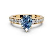 Solitaire Engagement Ring Setting for Fancy Blue Pear-Shaped Center with Channel-Set Accents and Prong Head in Yellow Gold