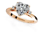 3 Stone Engagement Ring Setting for Heart-Shaped Center with Low-Set Round Cut Accents and Prong Head in Rose Gold