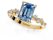 Solitaire Engagement Ring Setting for Fancy Blue Emerald Cut Center with Trailing Leaf Accent Band and Prong Head in Yellow Gold
