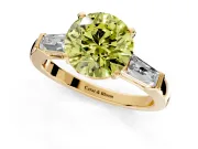 3 Stone Engagement Ring Setting for Fancy Yellow Round Cut Center with Tapered Baguettes, Plain Band and Prong Head in Yellow Gold