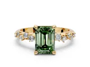 Solitaire Engagement Ring Setting for Fancy Green Emerald Cut Center with Trailing Leaf Accent Band and Prong Head in Yellow Gold