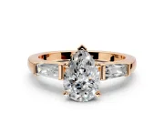 3 Stone Engagement Ring Setting for Pear-Shaped Center with Tapered Baguettes, Plain Band and Prong Head in Rose Gold
