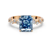 Cluster Engagement Ring Setting for Fancy Blue Radiant Cut Center with Round Cut Accent Band and Prong Head in Rose Gold