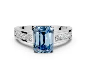 Solitaire Engagement Ring Setting for Fancy Blue Emerald Cut Center with Princess Cut Channel Band and Prong Head in Sterling Silver