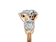 3 Stone Engagement Ring Setting for Heart-Shaped Center with Large Pear-Shaped Accents and Prong Head in Rose Gold