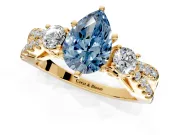 3 Stone Engagement Ring Setting for Fancy Blue Pear-Shaped Center with Pave Split Shank and Prong Head in Yellow Gold